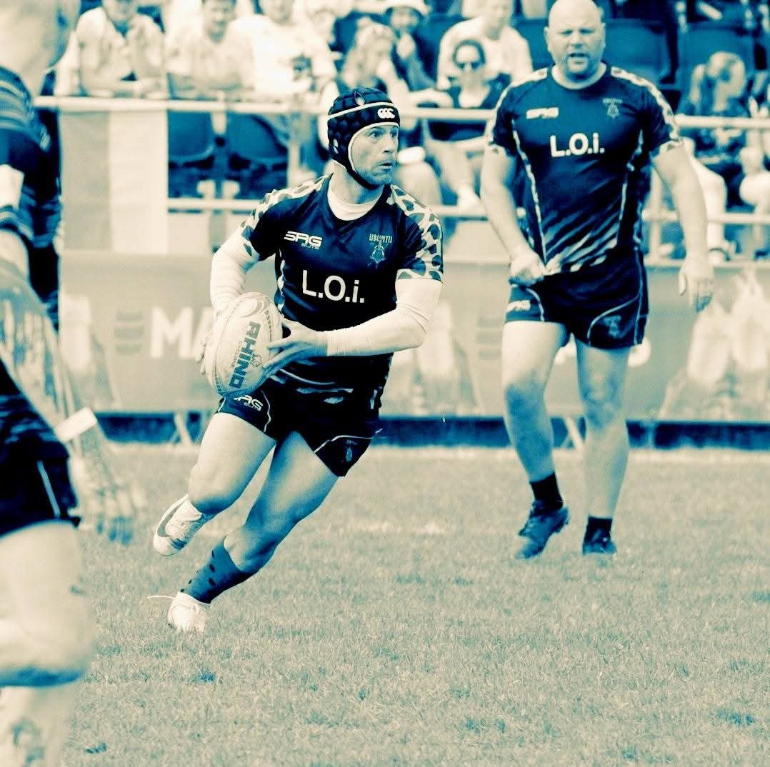 Barry de Jager playing rugby, captured mid-action